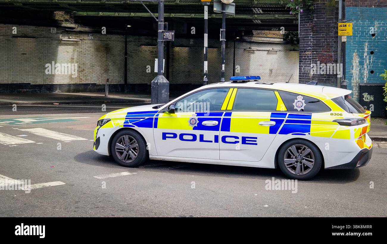 London, UK - July 22, 2024: United Kingdom Metropolitan Police car on a London city street at Finsbury Park. - Smartphone Captured Stock Image