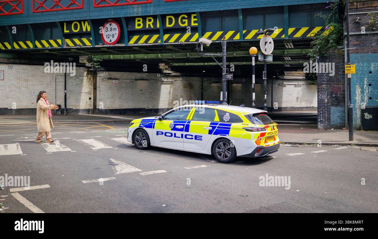 London, UK - July 22, 2024: United Kingdom Metropolitan Police car on a London city street at Finsbury Park. - Smartphone Captured Stock Image