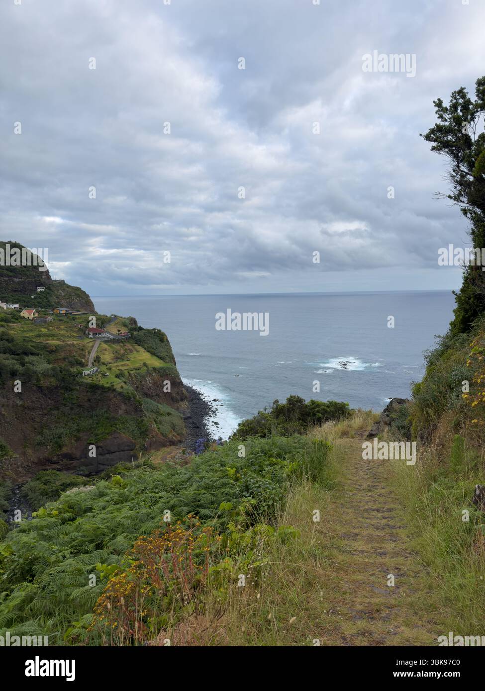 Picturesque green coast of Madeira Island, Portugal, offers an awe-inspiring view of its rugged coastline and powerful ocean waves. Travel concept - Smartphone Captured Stock Image