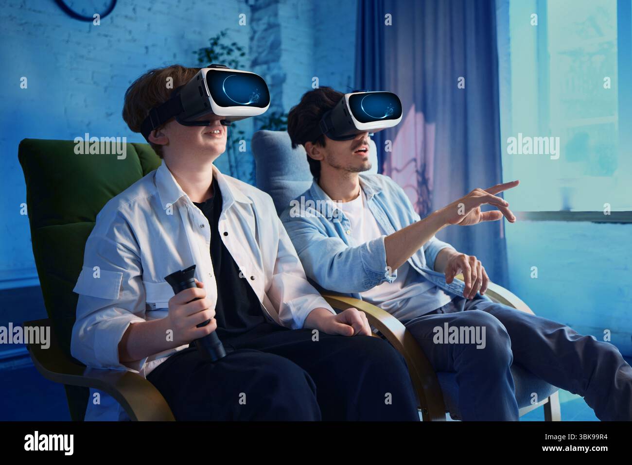 Father and son immersed in virtual reality experience in modern living ...