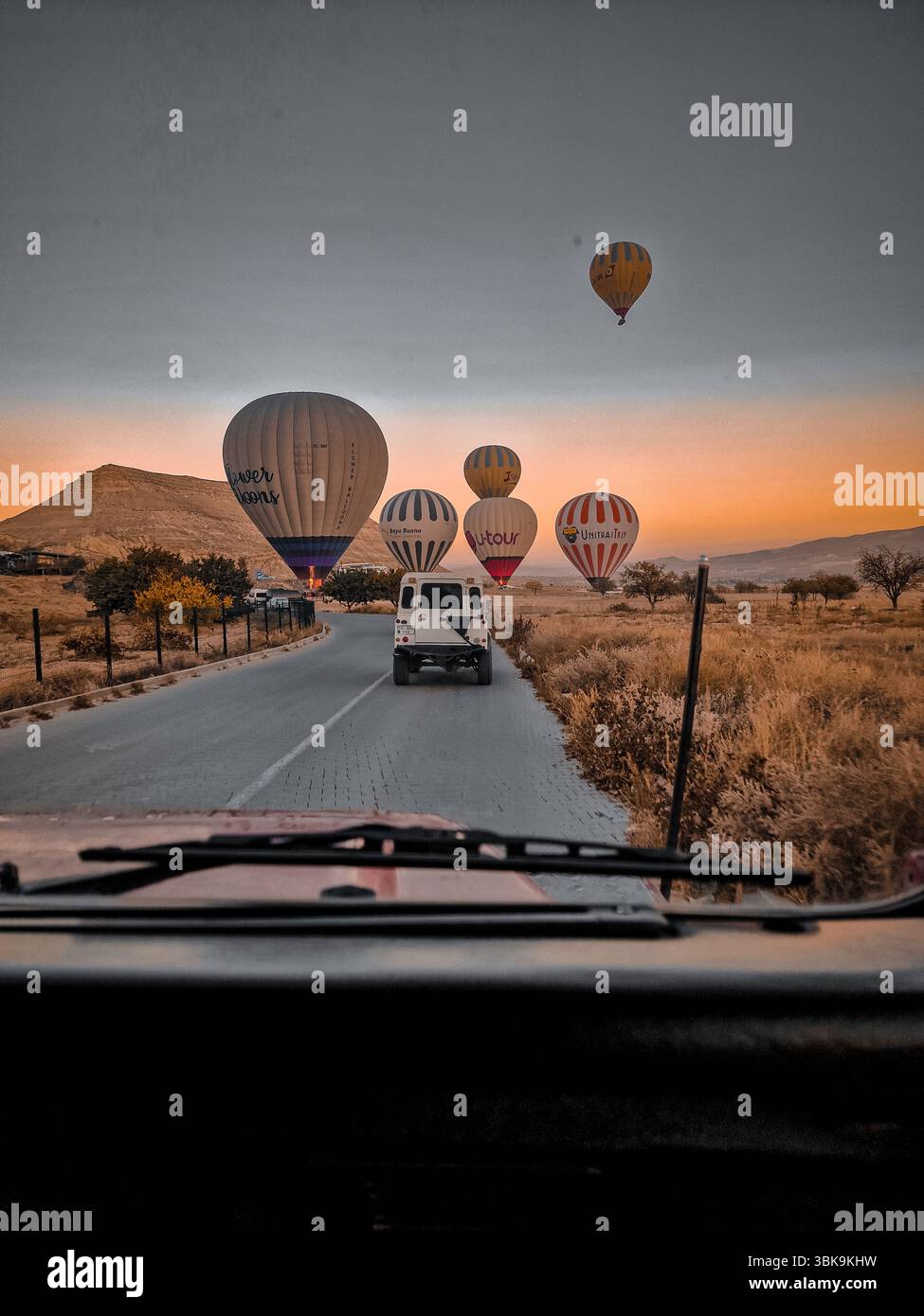 A natural view in the morning in Cappadocia. Hot air balloons flying in the sky of Goreme. There are hundreds of balloon tour providers. - Smartphone Captured Stock Image A natural view in the morning in Cappadocia. Hot air balloons flying in the sky of Goreme. There are hundreds of balloon tour providers. - Smartphone Captured Stock Image