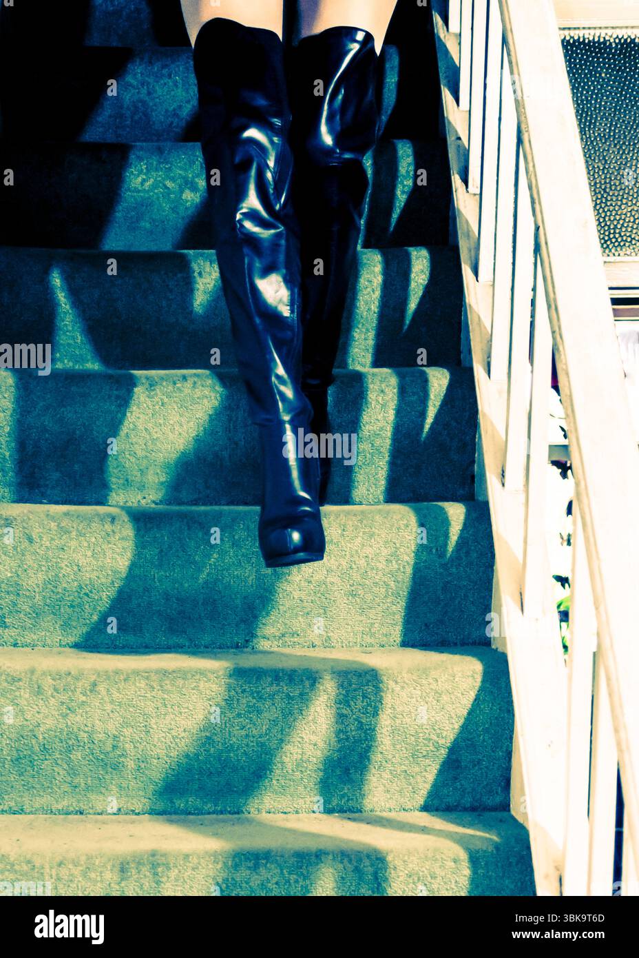 Woman in black boots walking hi-res stock photography and images - Alamy