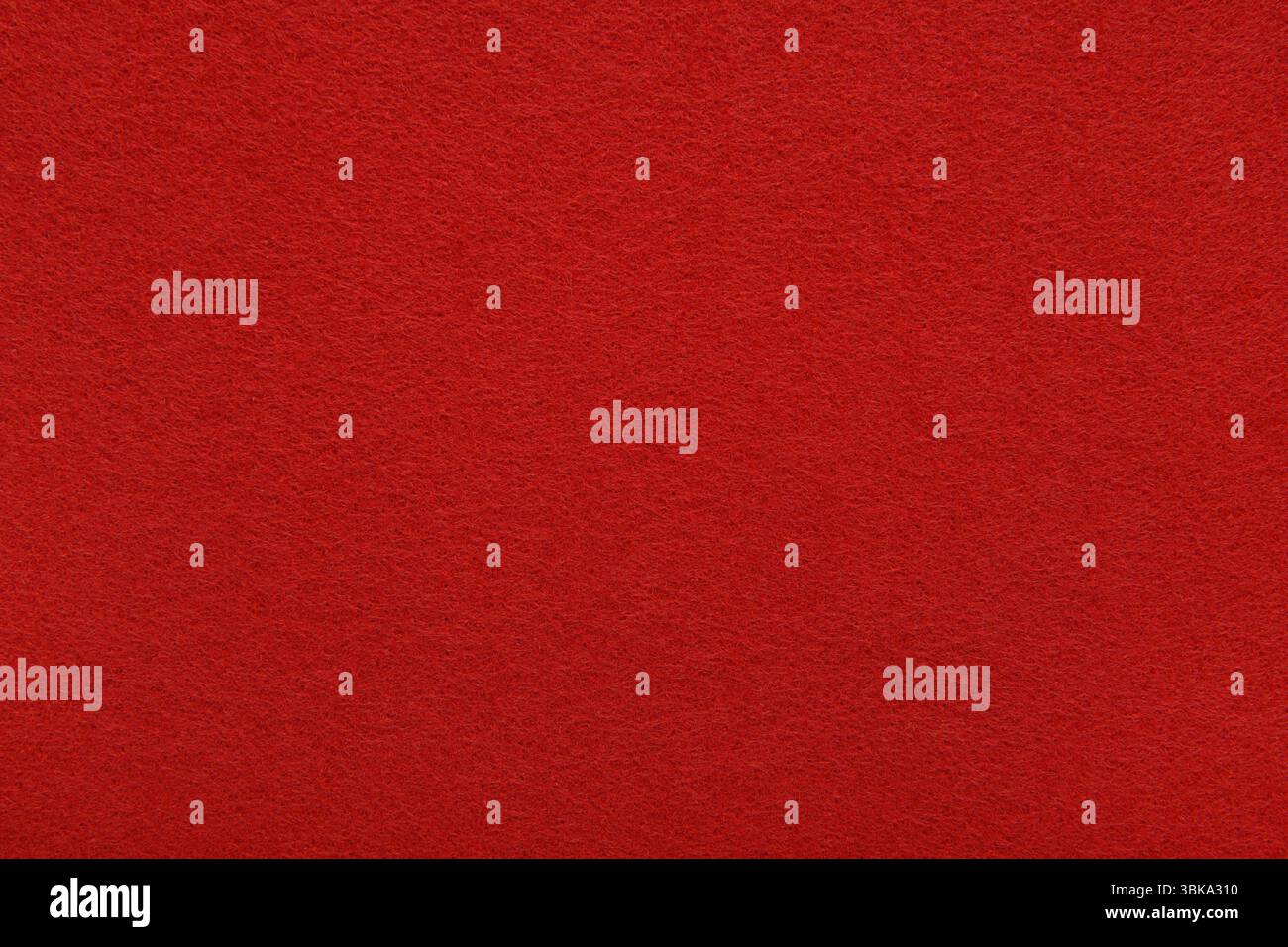 Red felt texture background - close-up of soft fabric surface. Seamless background, graphic design, scrapbooking, textile layouts, creative projects. Stock Photo