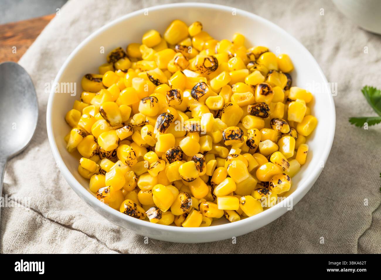 Homemade Fire Roasted Corn Kernels in a Bowl Stock Photo