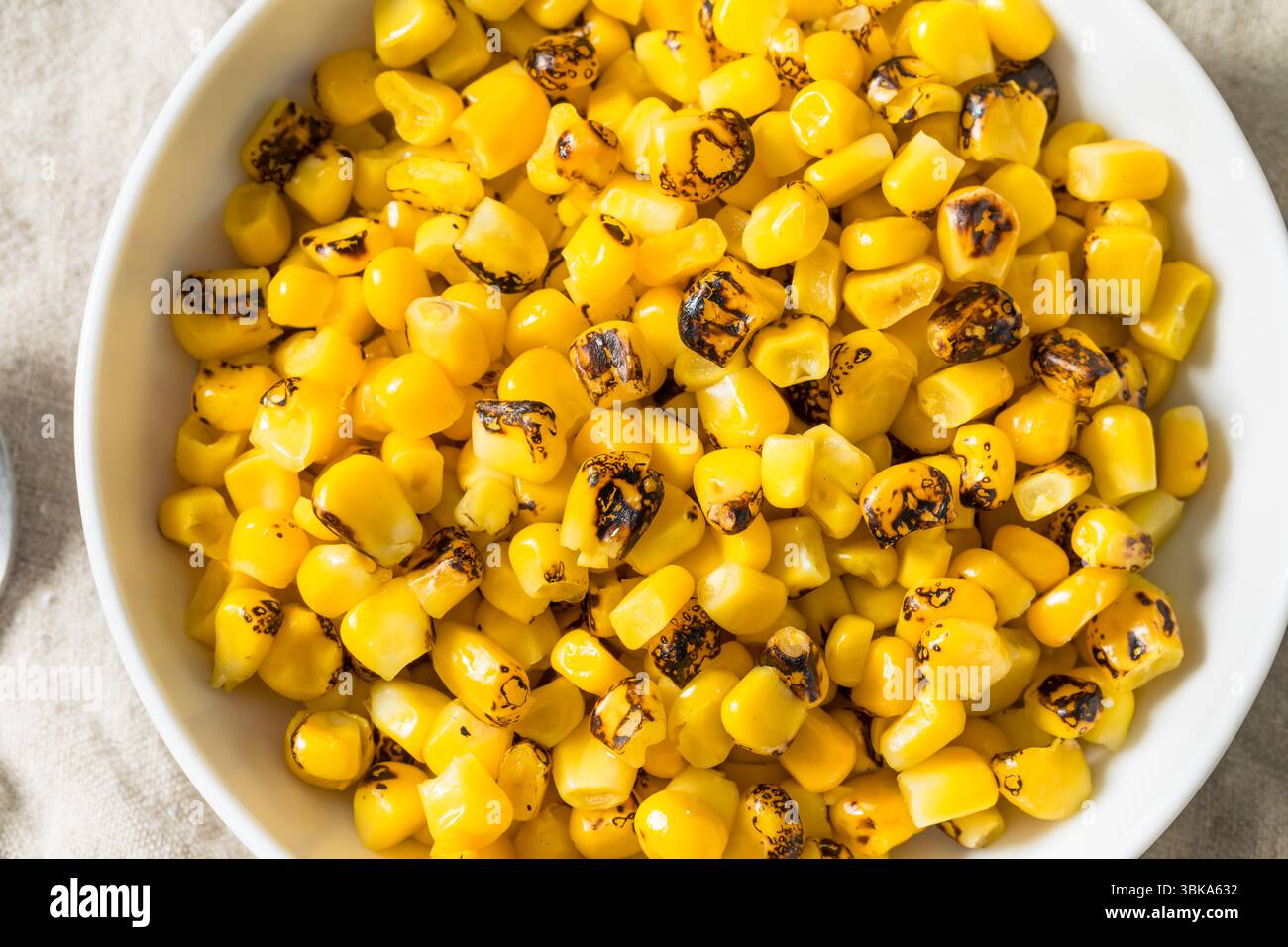 Homemade Fire Roasted Corn Kernels in a Bowl Stock Photo