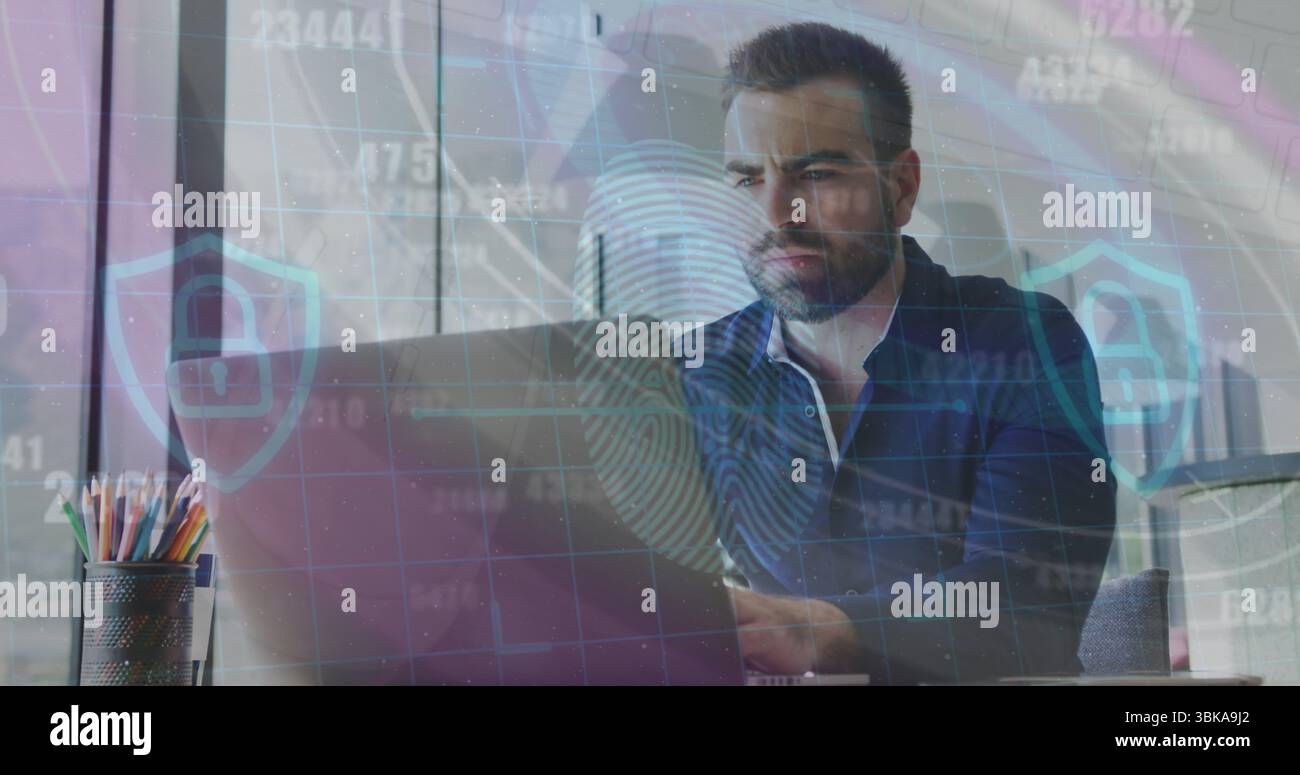 IT professional in dark blue shirt typing on laptop analyzing data in office, with colored pencils. Technology, workspace, urban, analysis, concentrat Stock Photo