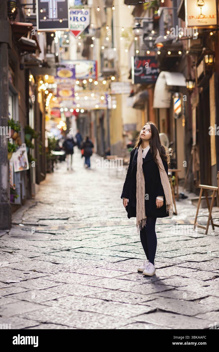 Fashionable woman in old town cobblestone street closeup Stock Photo