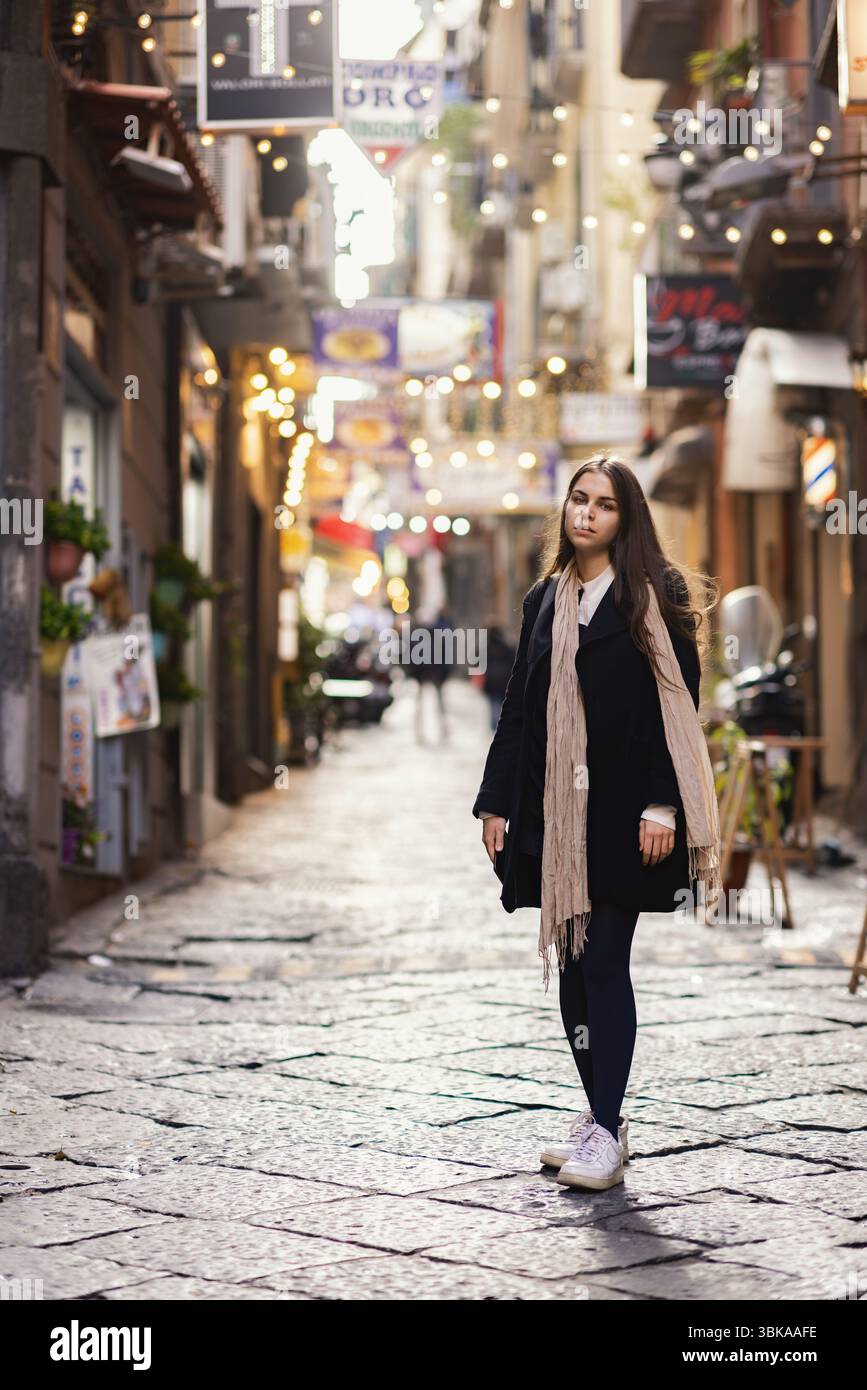 Fashionable woman in old town cobblestone street closeup Stock Photo