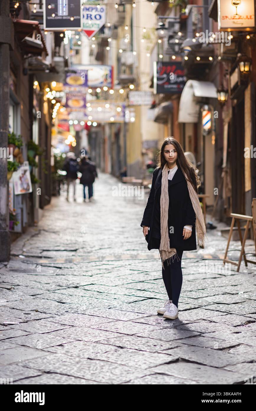 Fashionable woman in old town cobblestone street closeup Stock Photo