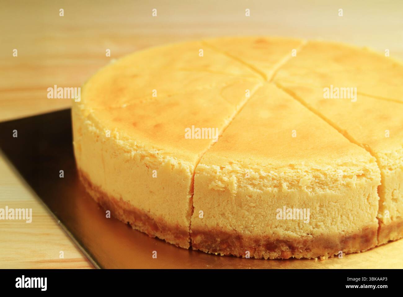 Closeup of delectable whole baked cheesecake Stock Photo