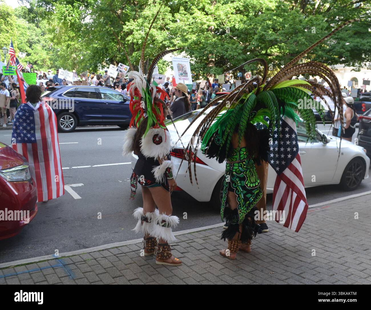 No Kings Rally Protesters in colorful, traditional Aztec dress in ...