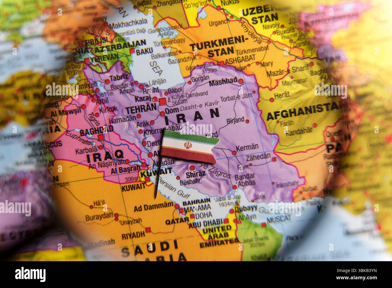 Map of Iran seen through magnifying glass with Iranian flag ...