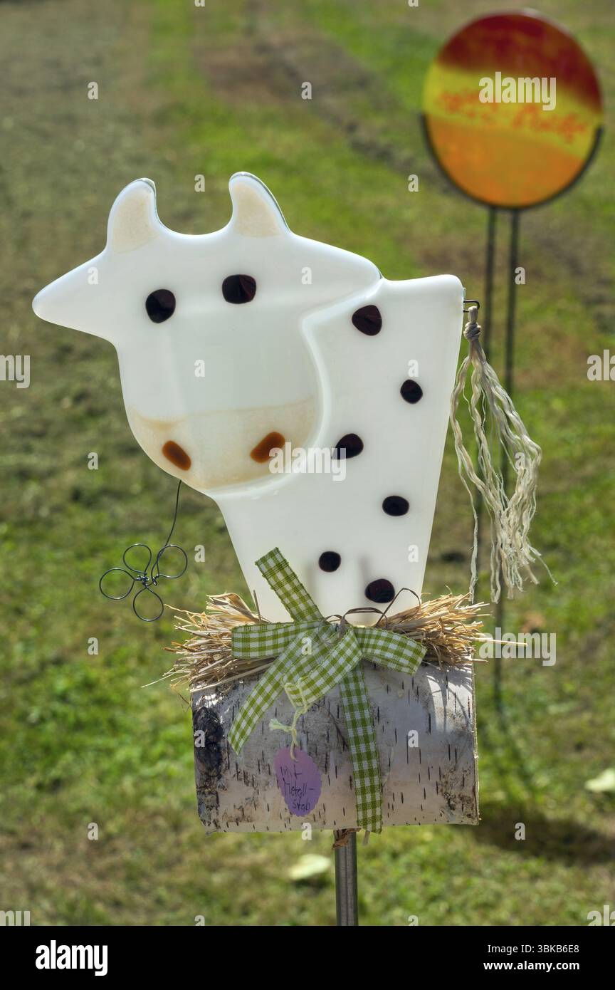 Glass cow with bow in the glassmaking village of Schmidsfelden today museum near Leutkirch, Allgaeu, Swabia, Bavaria, Germany, Europe Stock Photo