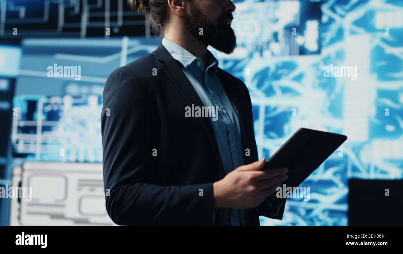 Tech savvy administrator reviewing AI brain programming on a tablet, exploring algorithmic thinking and deep learning through neural networks system. Artificial intelligence coding. Camera A. Stock Photo