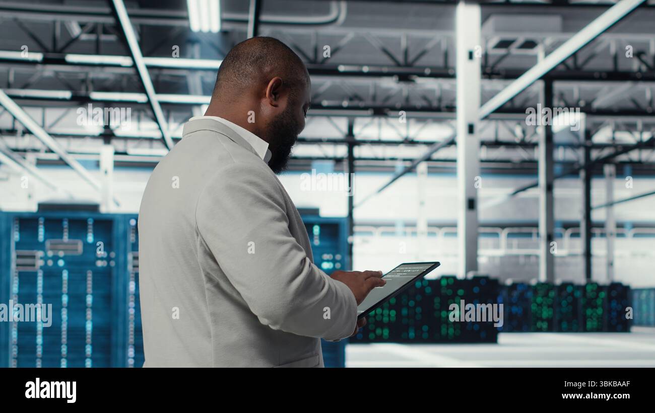 Cheerful data center programmer using hi res stock photography and