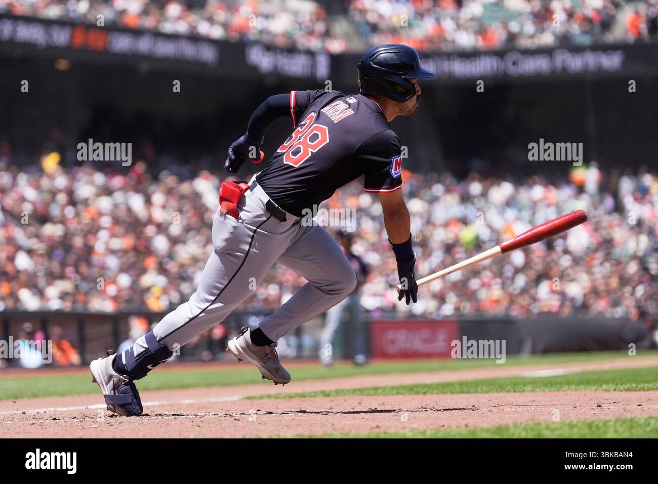 Cleveland Guardians' Steven Kwan watches his single against the San