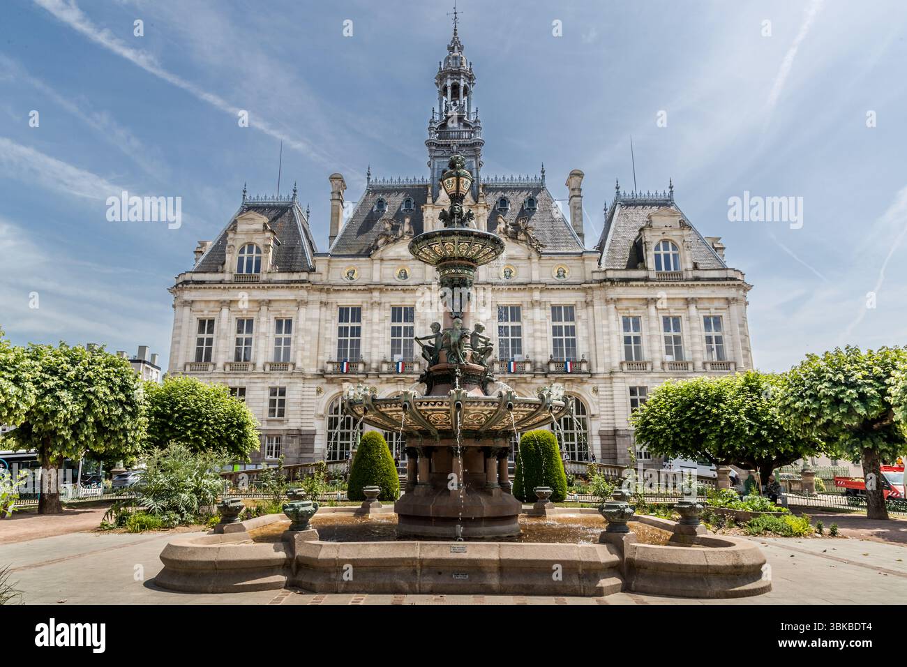 Limoges Town Hall with its fountain and elegant façade featuring a large clock and four portraits of important figures immortalised on the limestone façade. The town hall stands on the site of the city's ancient forum and is an architectural gem strongly inspired by the architecture of Paris City Hall. Rue Jean Pierre Timbaud, Limoges, Nouvelle-Aquitaine, France Stock Photo