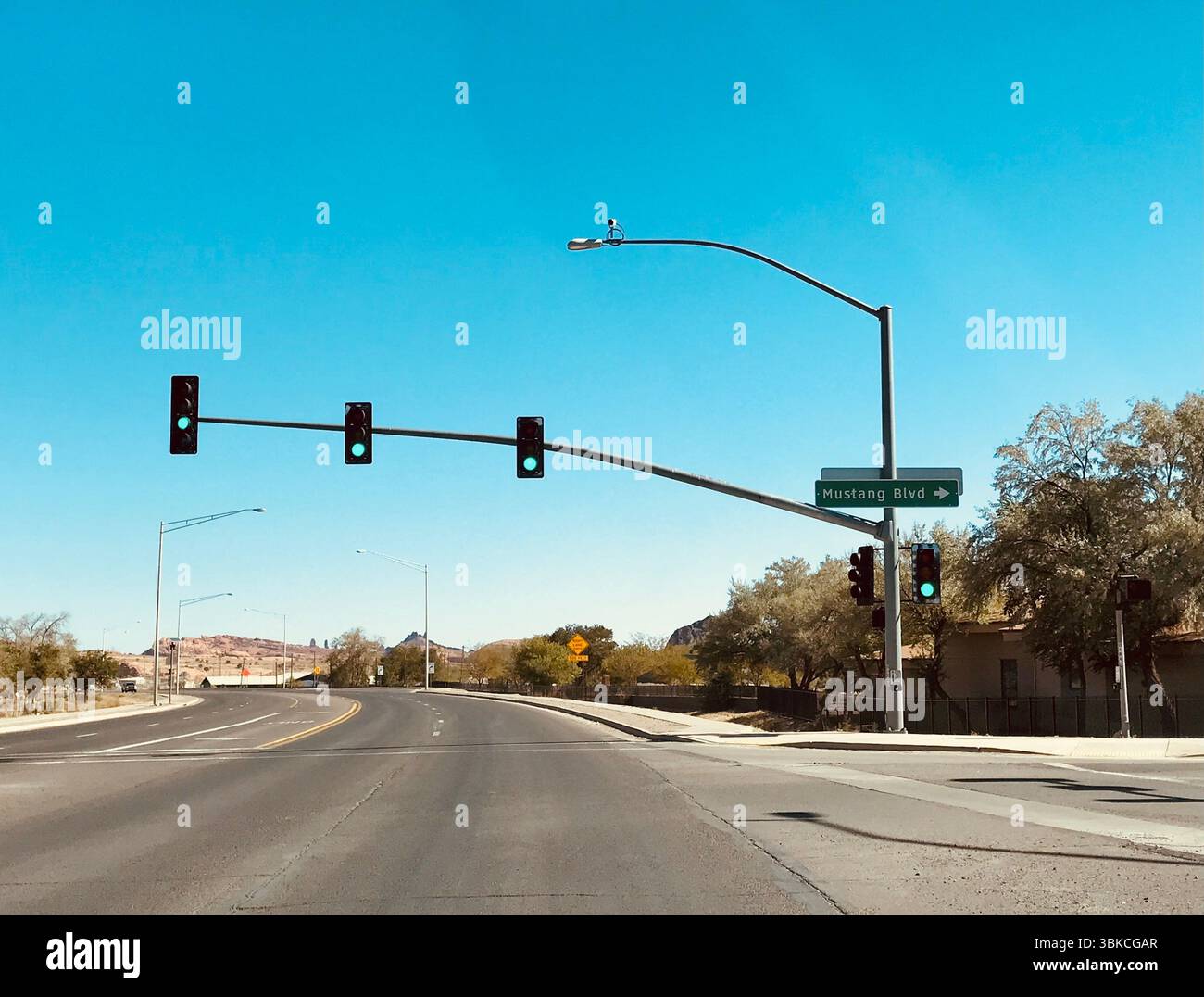 Desert Road Intersection with Traffic Lights and Mustang Blvd Sign, Page, Arizona Stock Photo