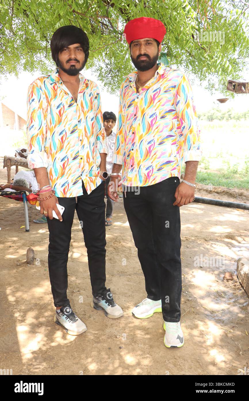 Two Young Indian Men Standing Outdoors Stock Photo