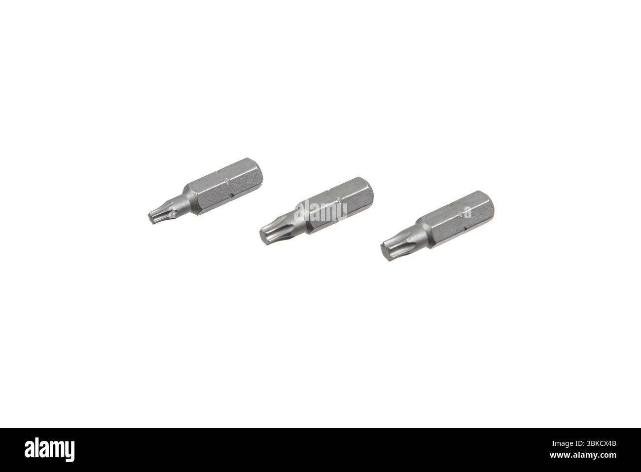Three silver Torx screwdriver bits arranged on white background Stock Photo
