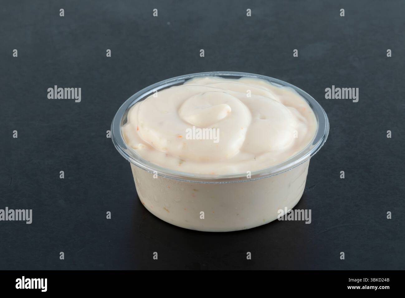 Garlic sauce isolated on black background. Stock Photo