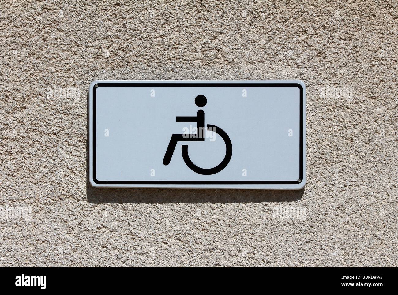 Simple wheelchair accessibility sign with black symbol on white ...