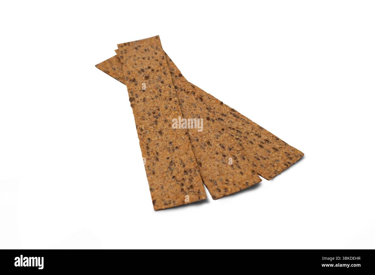 Stack of three rectangular bread crisps isolated on white background. Top view close-up. Stock Photo