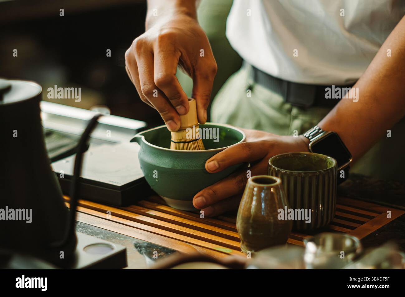 Hands whisking matcha. A traditional Japanese green tea. The calming ...
