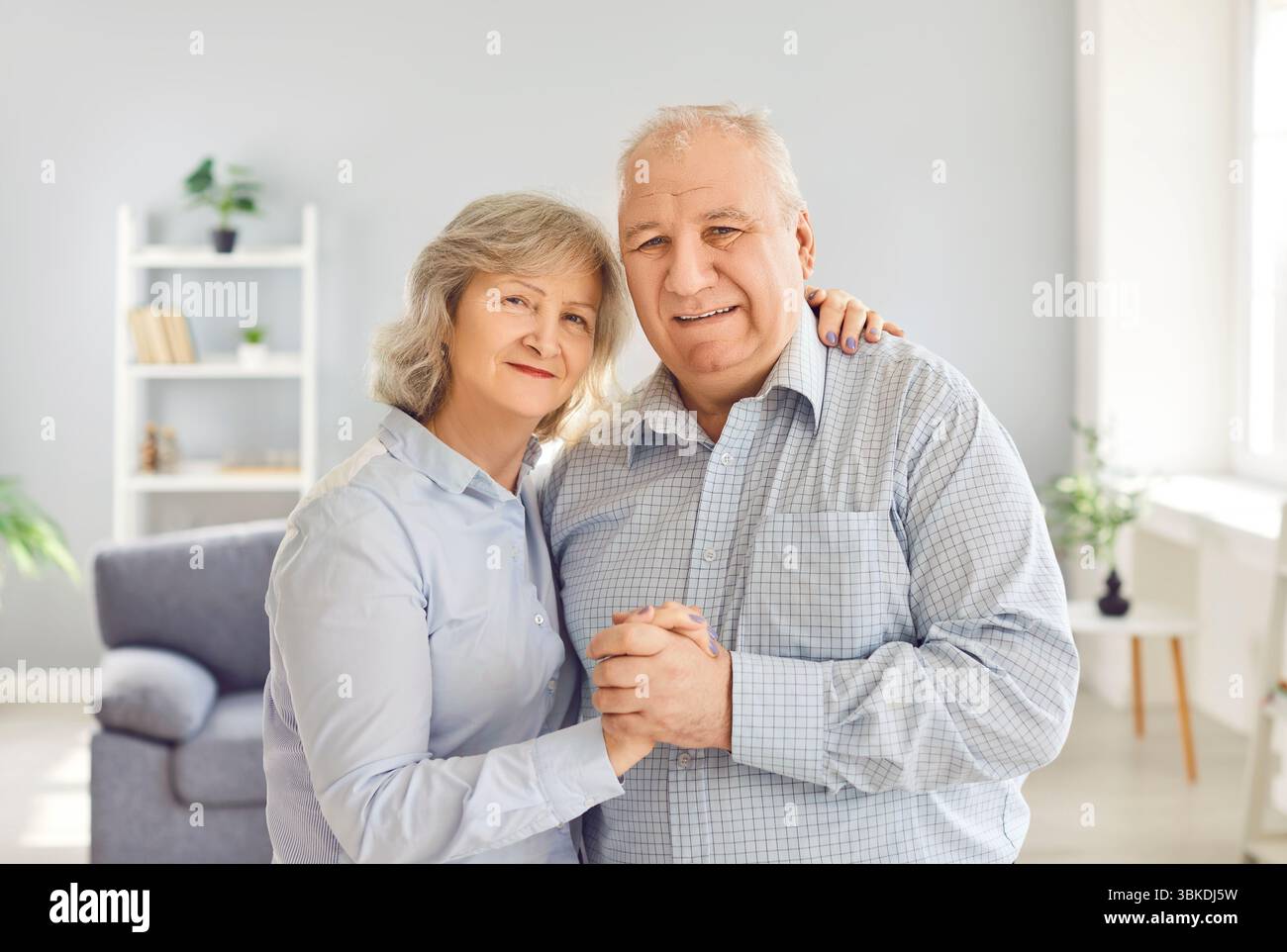 Senior couple portrait, close sincere bonding happy aged old married couple cuddling Stock Photo