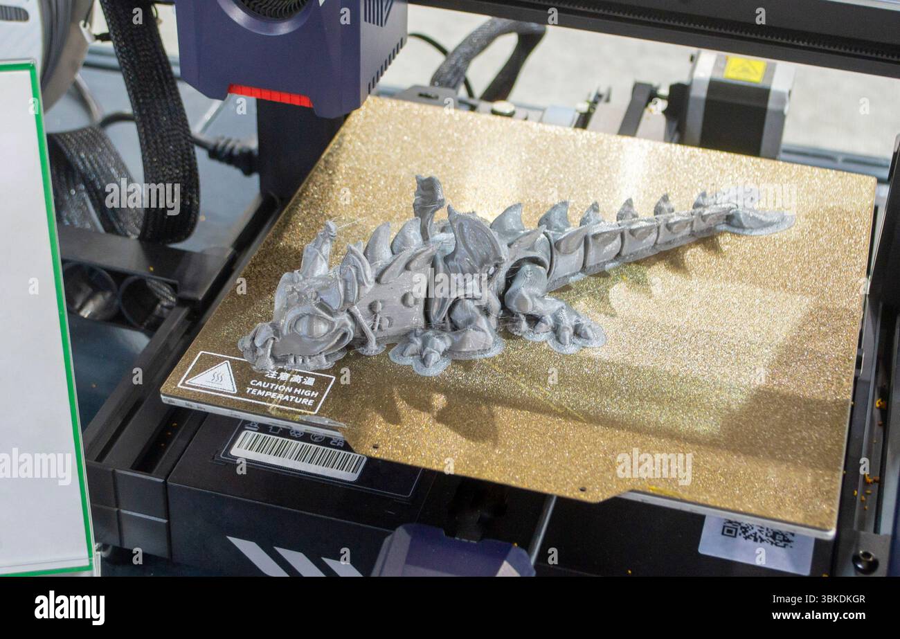 Art model of a toy printed on a 3D printer from molten plastic on the ...