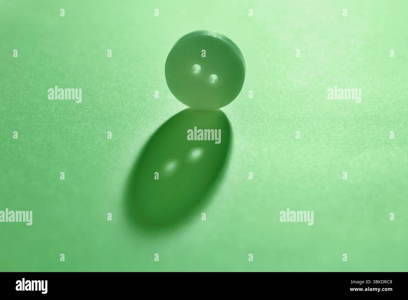 Green  button on green  background , abstract minimal background Stock Photo