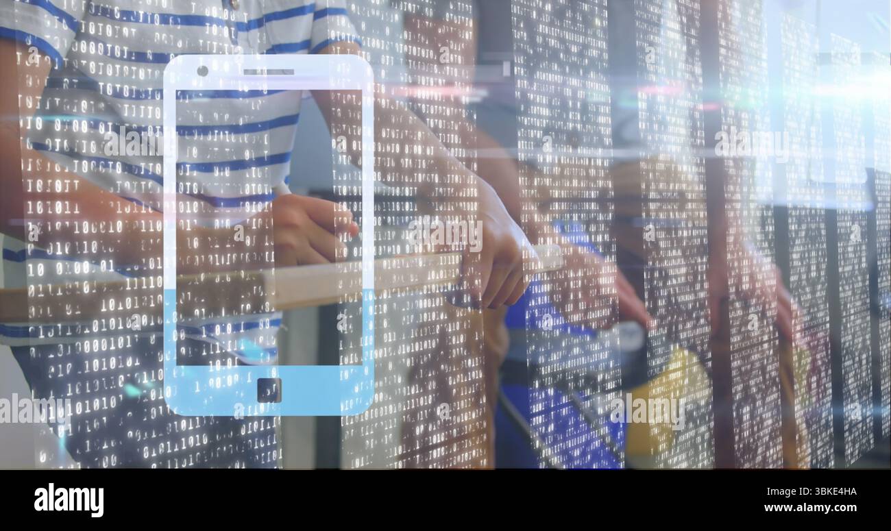 Projecting smartphone hologram with binary code on tall desk in office, father and son using tablet Stock Photo