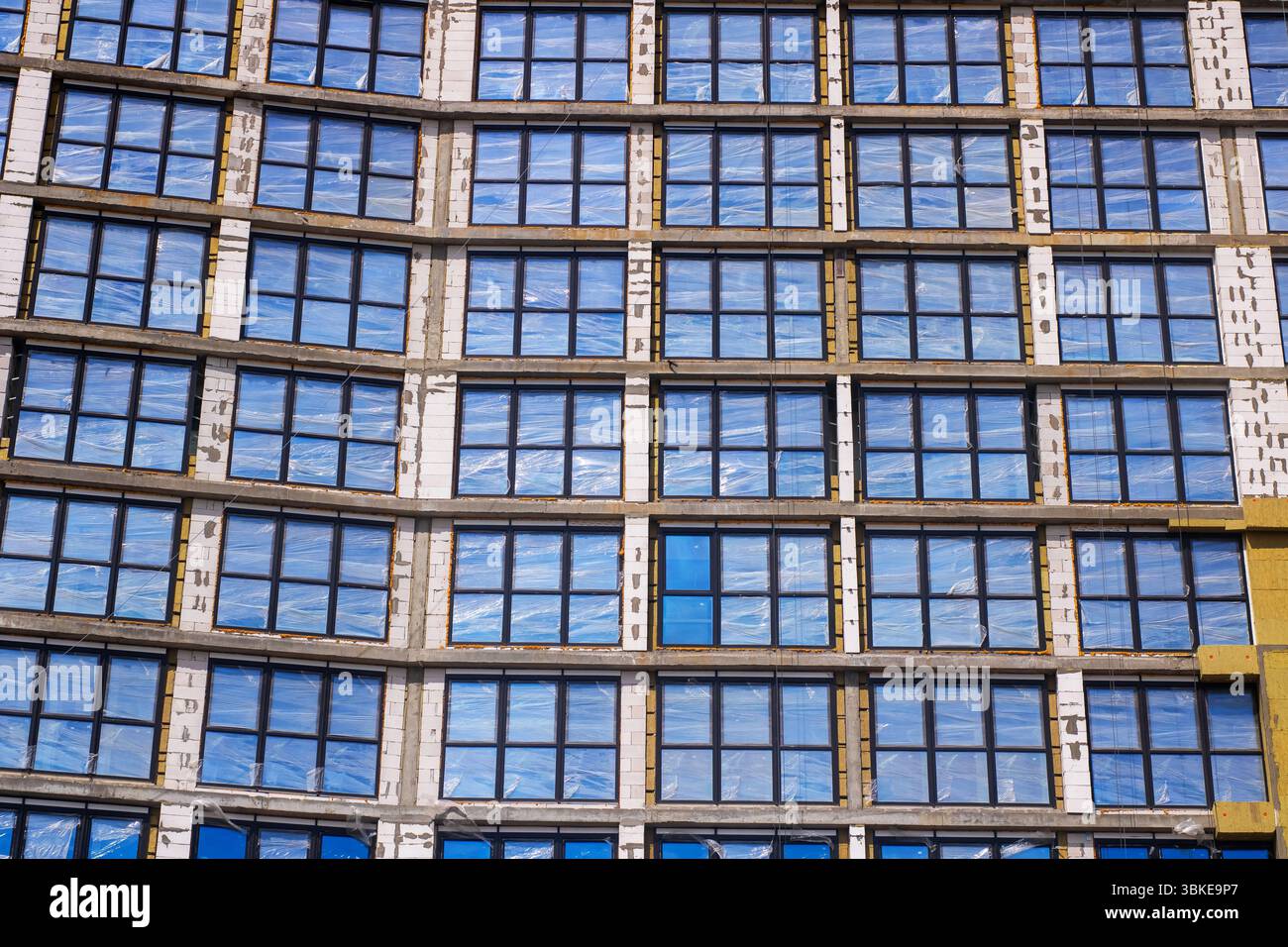A large building featuring numerous windows is currently undergoing ...