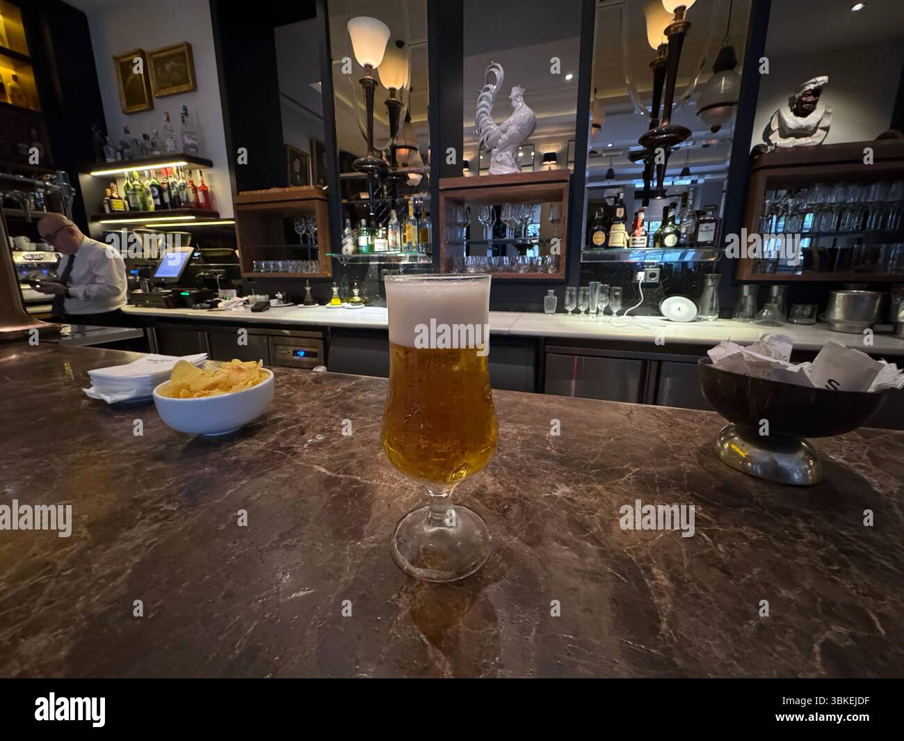Caña de cerveza, beer and potato chips as tapas  in Narciso restaurant and bar, Chamberi, Madrid , Spain - Smartphone Captured Stock Image