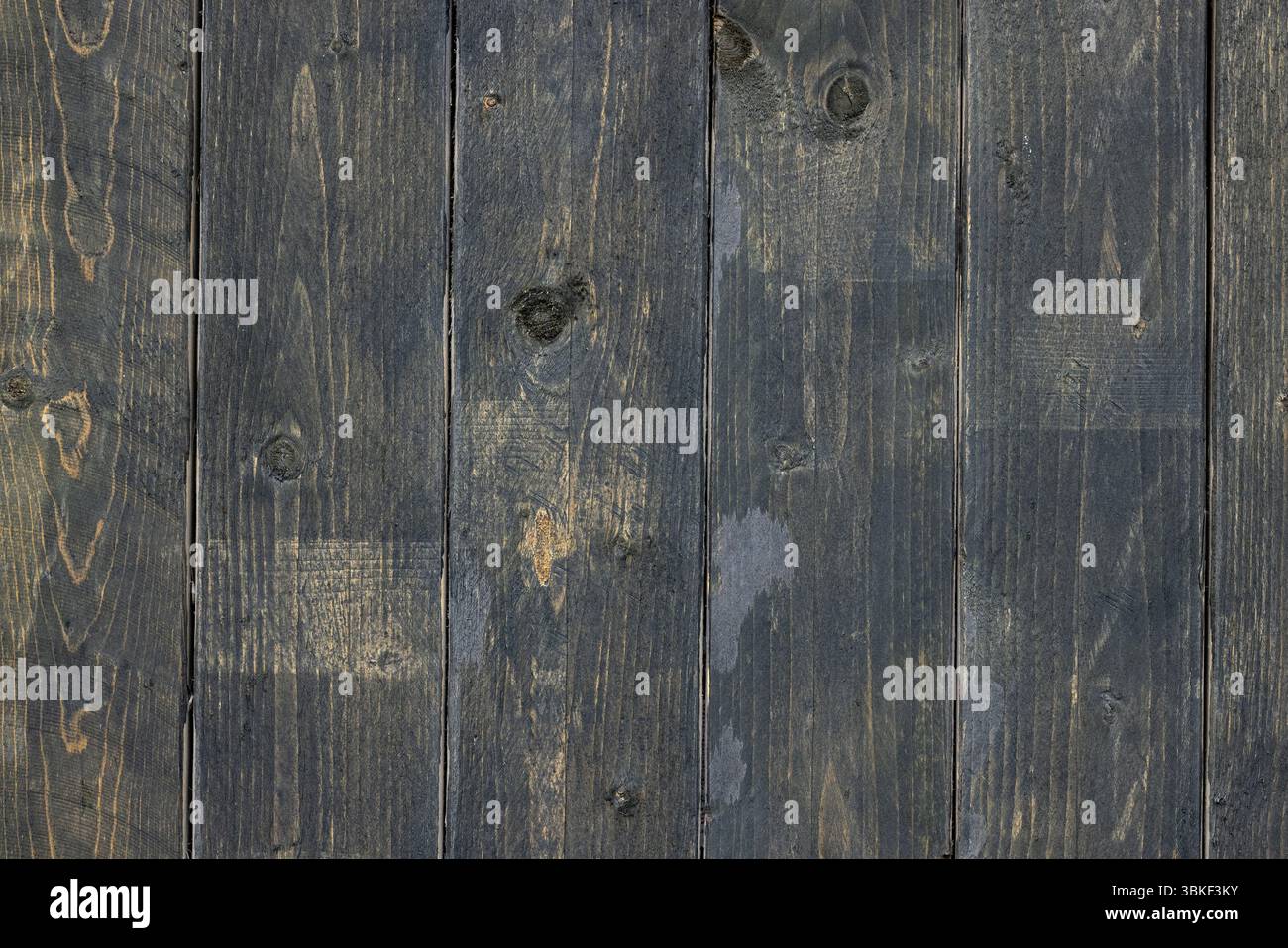 old dark painted wooden wall background Stock Photo
