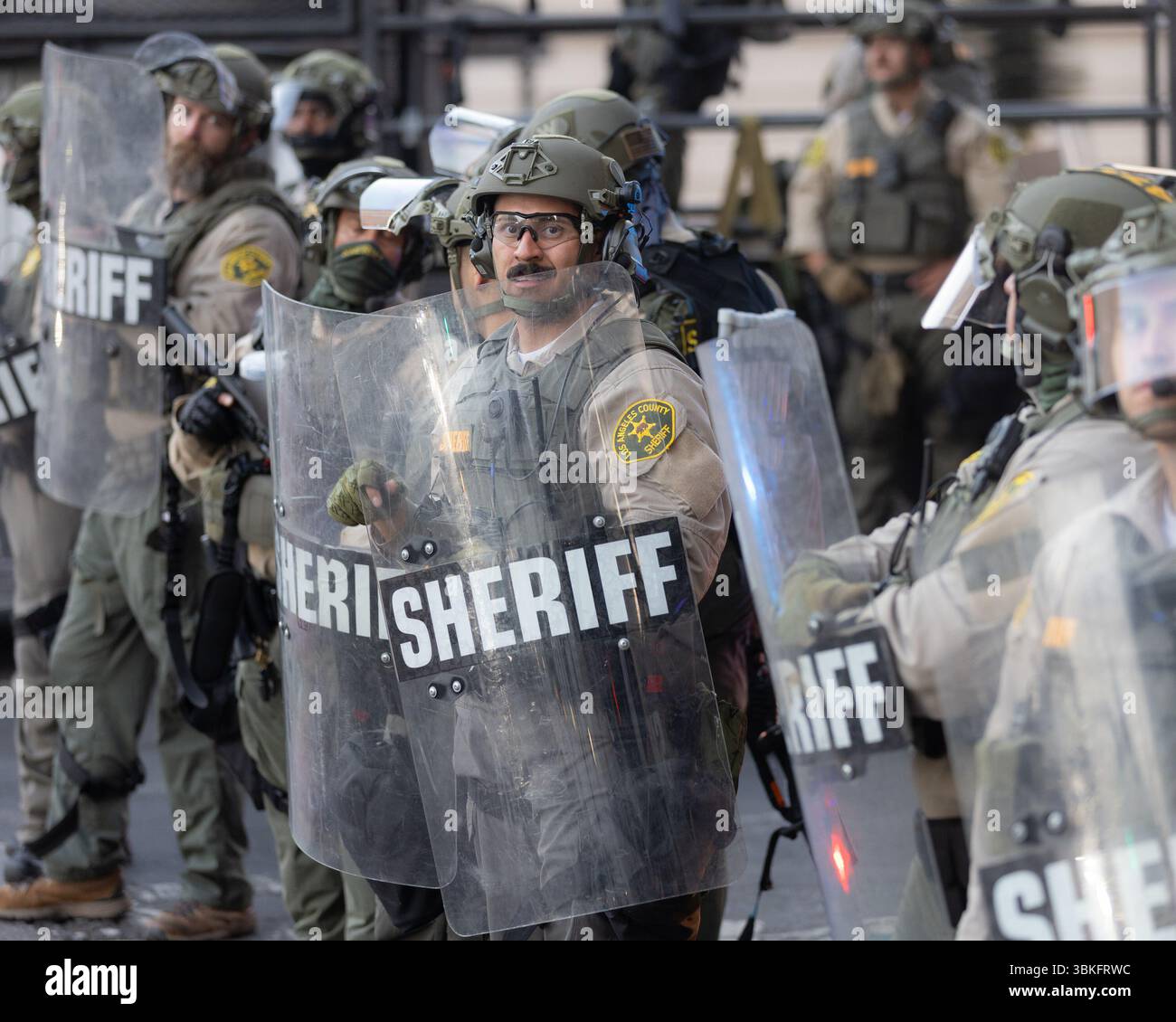 Los Angeles County Sheriff’s deputies in tactical gear stand in ...