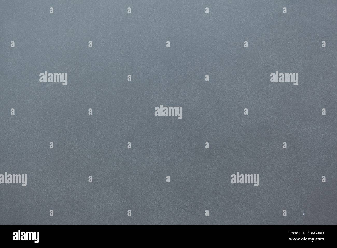 Grey textured surface is filling flat design frame while showing subtle grainy details Stock Photo