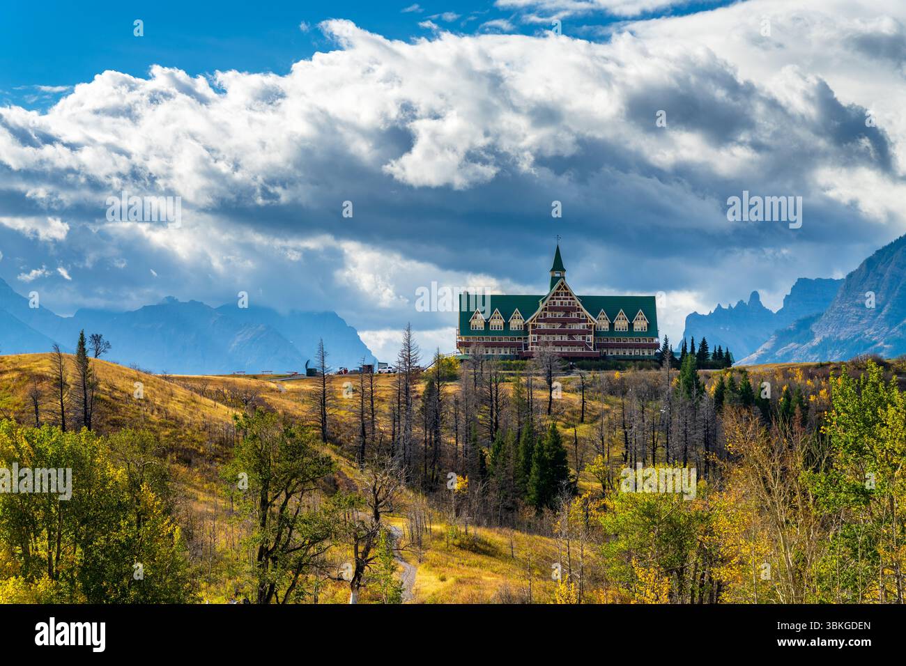 Waterton Lakes National Park, Alberta, Canada. Middle Waterton in a sunny autumn morning. Blue sky, white clouds, and mountains. Stock Photo