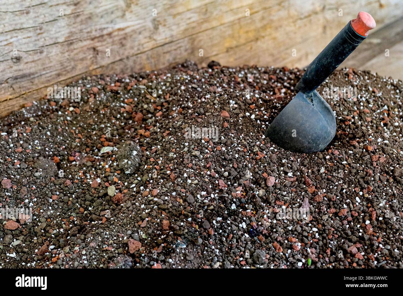 Soil, nutrient substrate and a scoop for transplanting potted plants ...