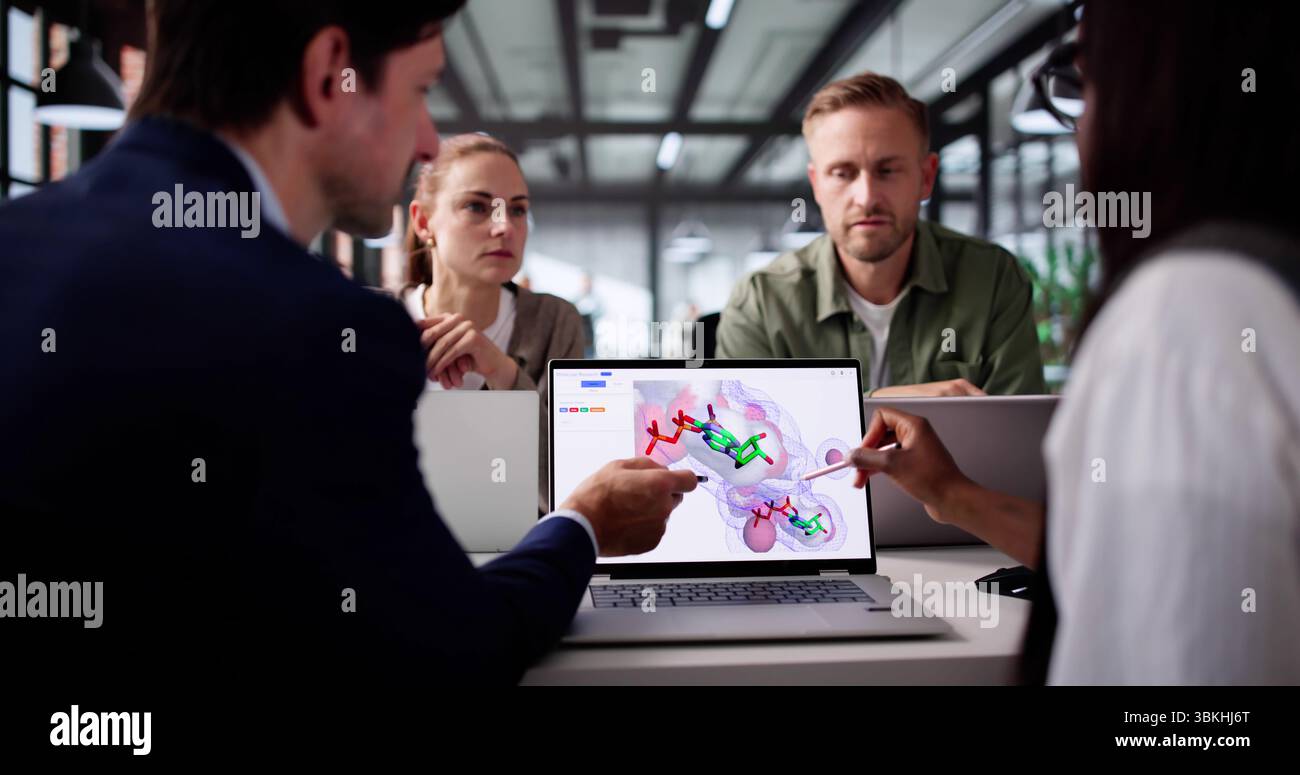 Scientist Using Supercomputer To Analyze Protein Molecule Structure In Lab. Stock Photo
