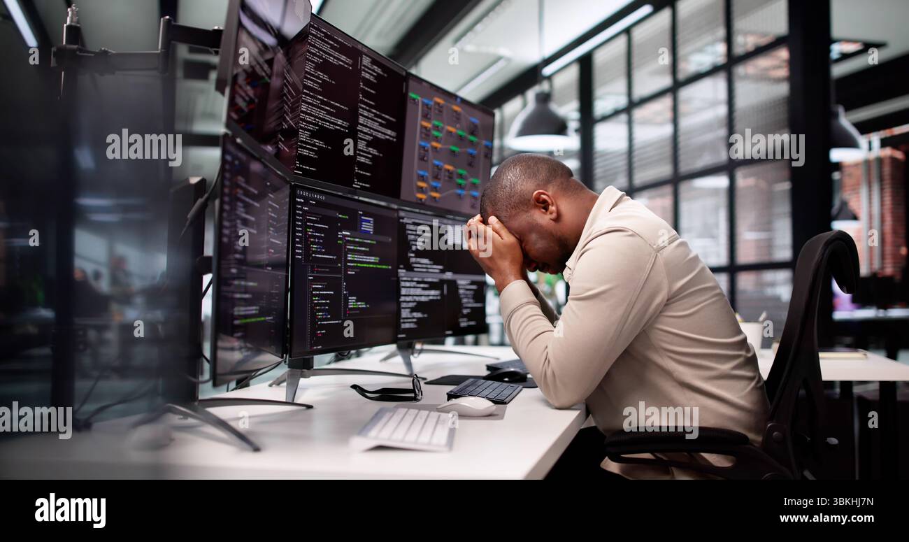The Frustrated Programmer: A Sad Man Struggles With Software Development. Stock Photo