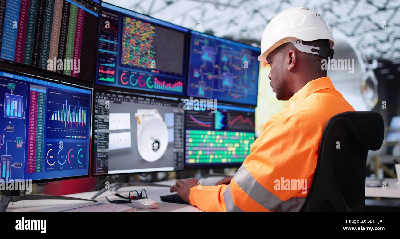 Young Engineer Developing Solar Panels Using 3D CAD Design Software. Stock Photo