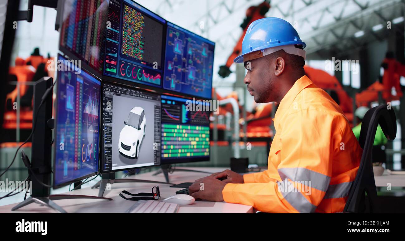 Young African American Engineer Developing Software For Automotive Electrical Assembly. Stock Photo