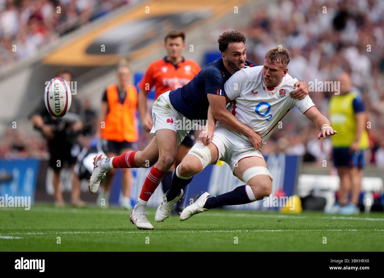 England's Alex Dombrandt is tackled by France's Leo Berdeu during the ...