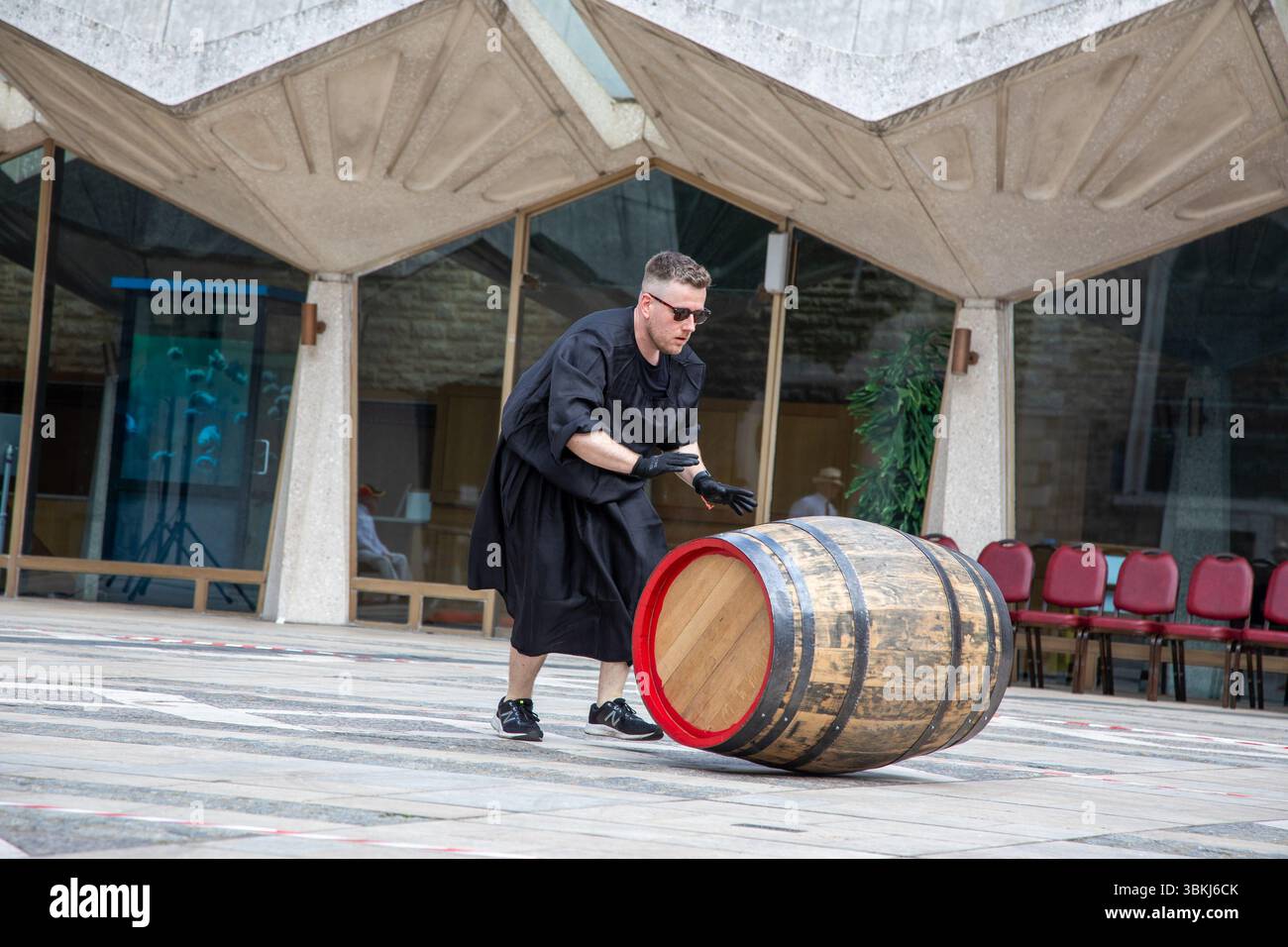 London, England, UK. 21st June 2025. The Worshipful Company of Coopers hosted the fourth annual Coopers’ Cask Race in Guildhall Yard, where 26 teams, including livery companies, schools, uniformed services, and Yeoman Warders, competed in a lively barrel-rolling celebration. Credit:Kiki Streitberger/Alamy Live News Stock Photo