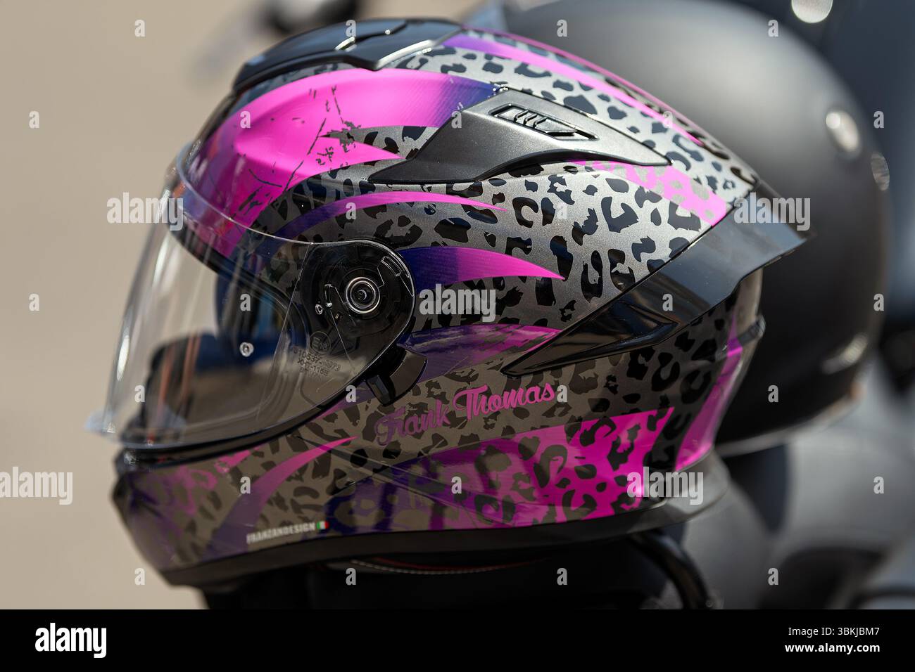A colourful motorbike helmet belonging to a Harley Davidson rider on display at the ride in Sheringham, North Norfolk, UK Stock Photo