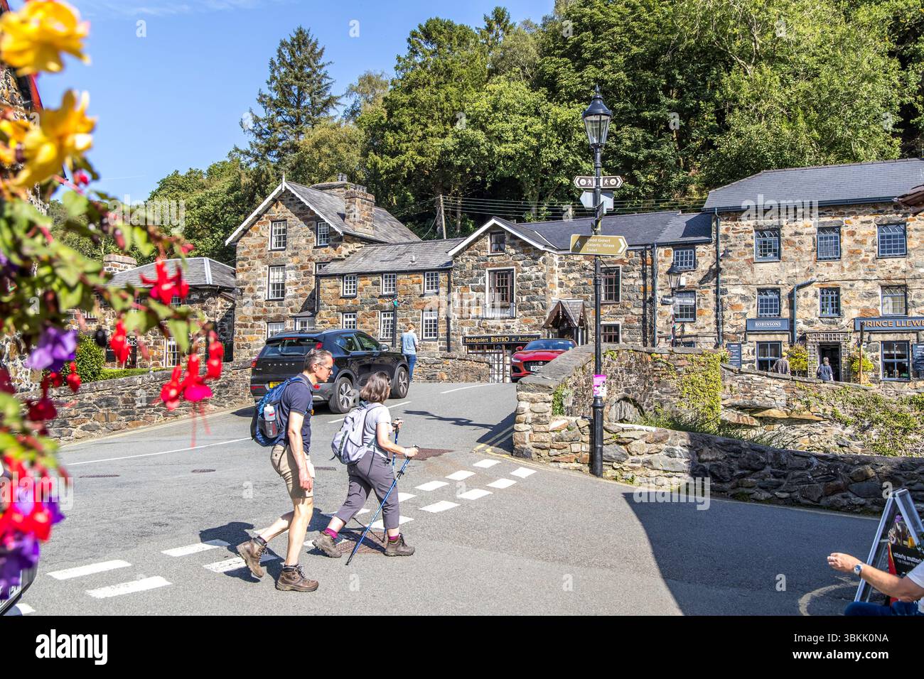 Beddgelert, Wales - September 6, 2023: The picturesque bridge in the center of Beddgelert popular hiking spot. Stock Photo