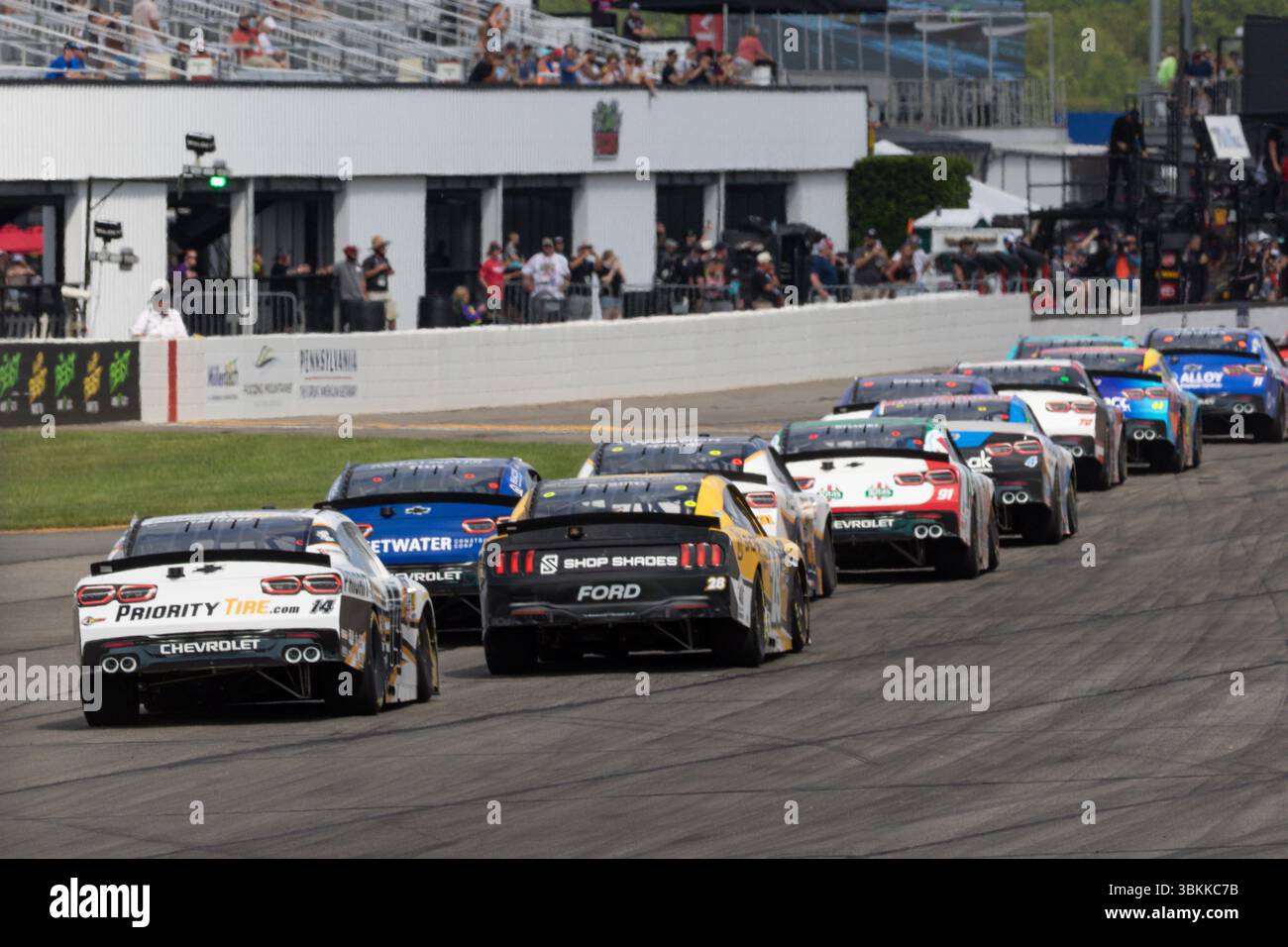 LONG POND, PA - JUNE 21: The field hits pit road after a caution during ...