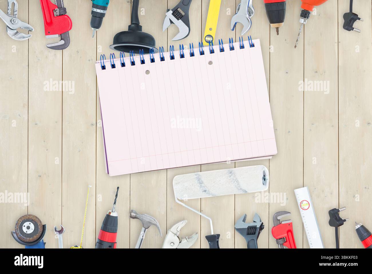 Tools and notepad on wooden background Stock Photo - Alamy