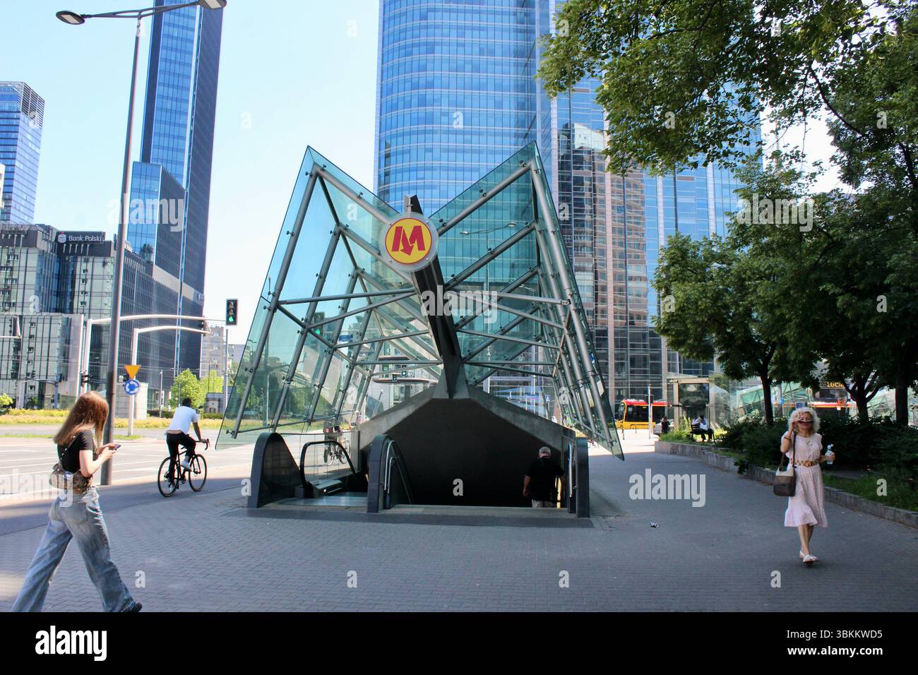 Rondo ONZ entrance to metro station with view of tower office blocks ...
